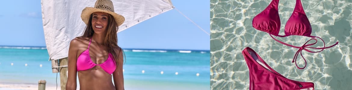 Roze bikini die in het water drijft