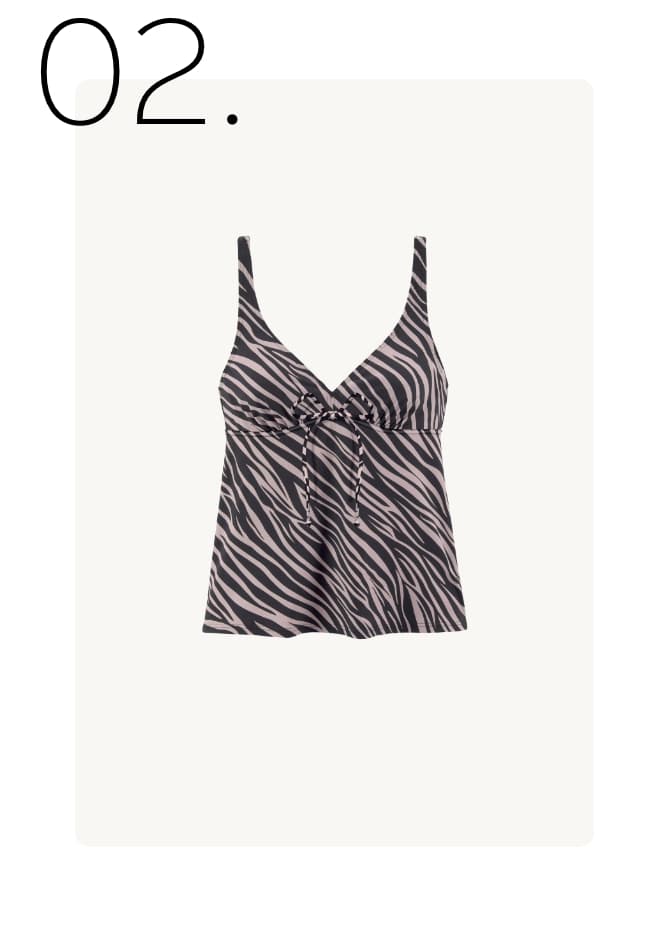 02. - Top met zwart-wit zebraprint en strikdetail aan de voorkant